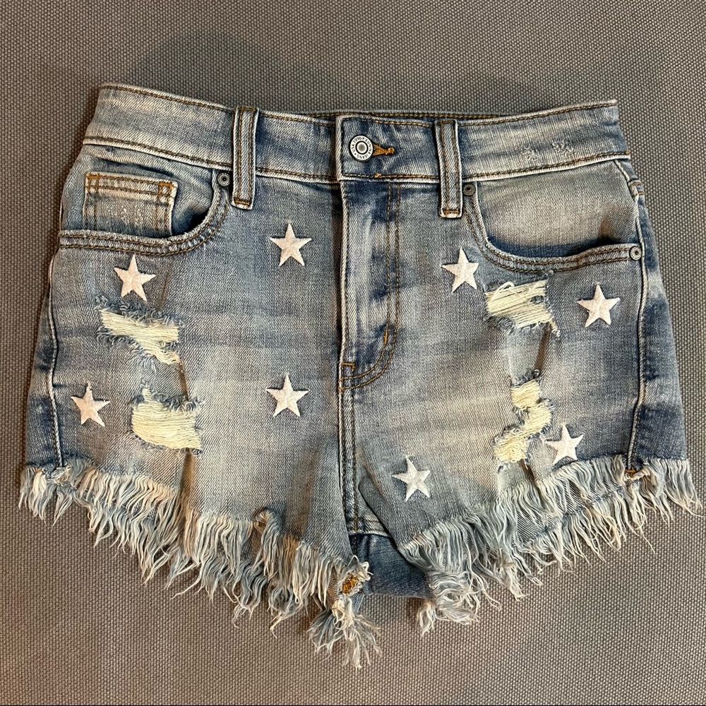 High rise cut off shorts with stitched stars. Size XS.
